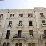 Proseguiamo di qualche metro per raggiungere l�angolo con via Piccinni, dove fa bella mostra di s� uno dei pi� riusciti esempi di liberty di Bari: un palazzo del 1911 caratterizzato da due finte torri laterali aggettanti e da una fascia di piastrelle in ceramica decorata con motivi floreali che funge da parapetto alle finestre dell�ultimo piano